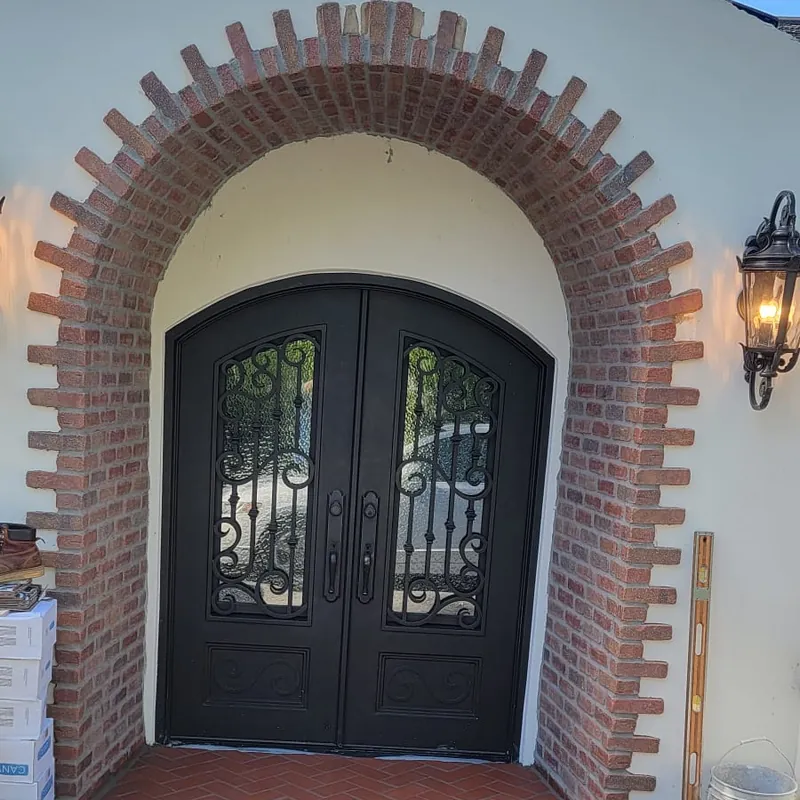 Brick arch and round brick step framing a Sacramento front entry