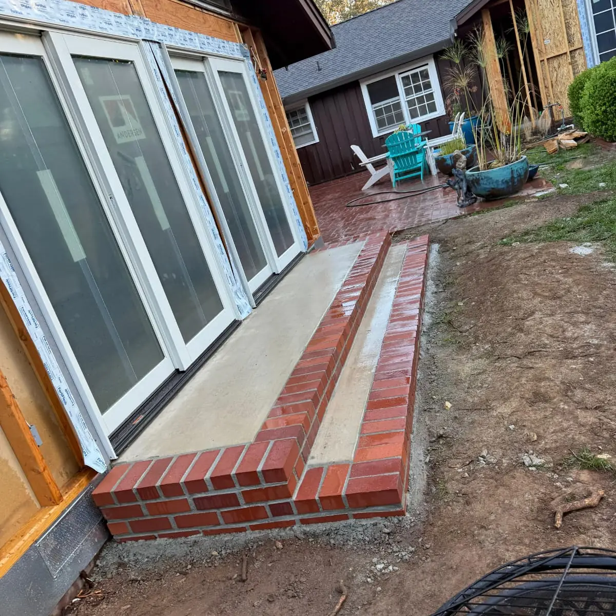 Brick porch step and walkway edge under construction in Sacramento
