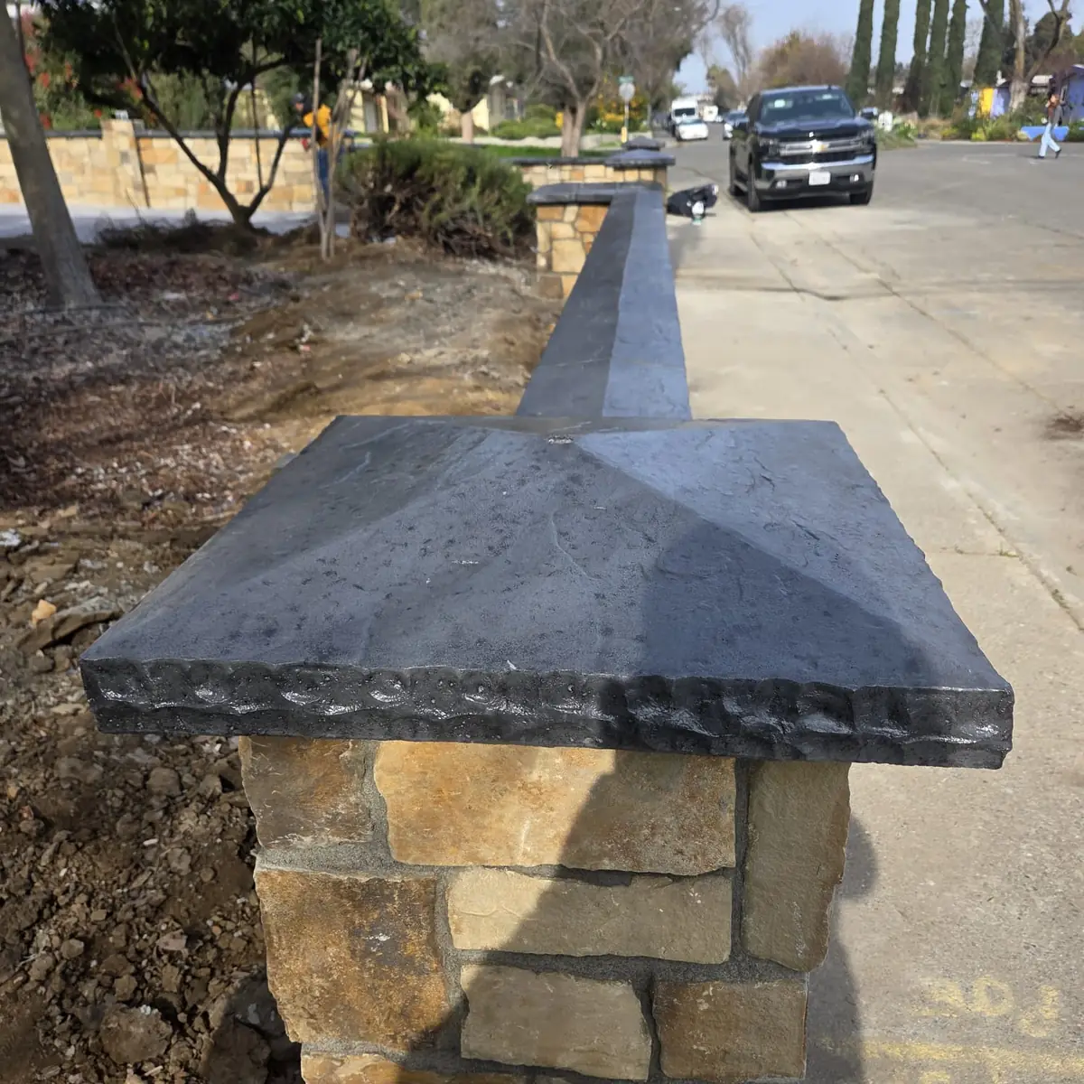 Close view of a cut stone pillar cap set by a Sacramento mason